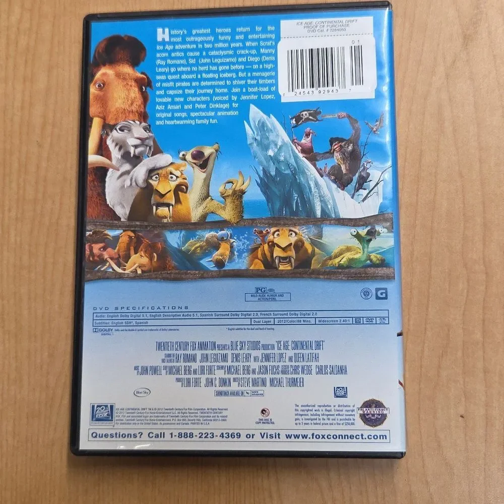 collection of Ice Age merchandise, including a VHS tape, two DVDs, Sid the Sloth